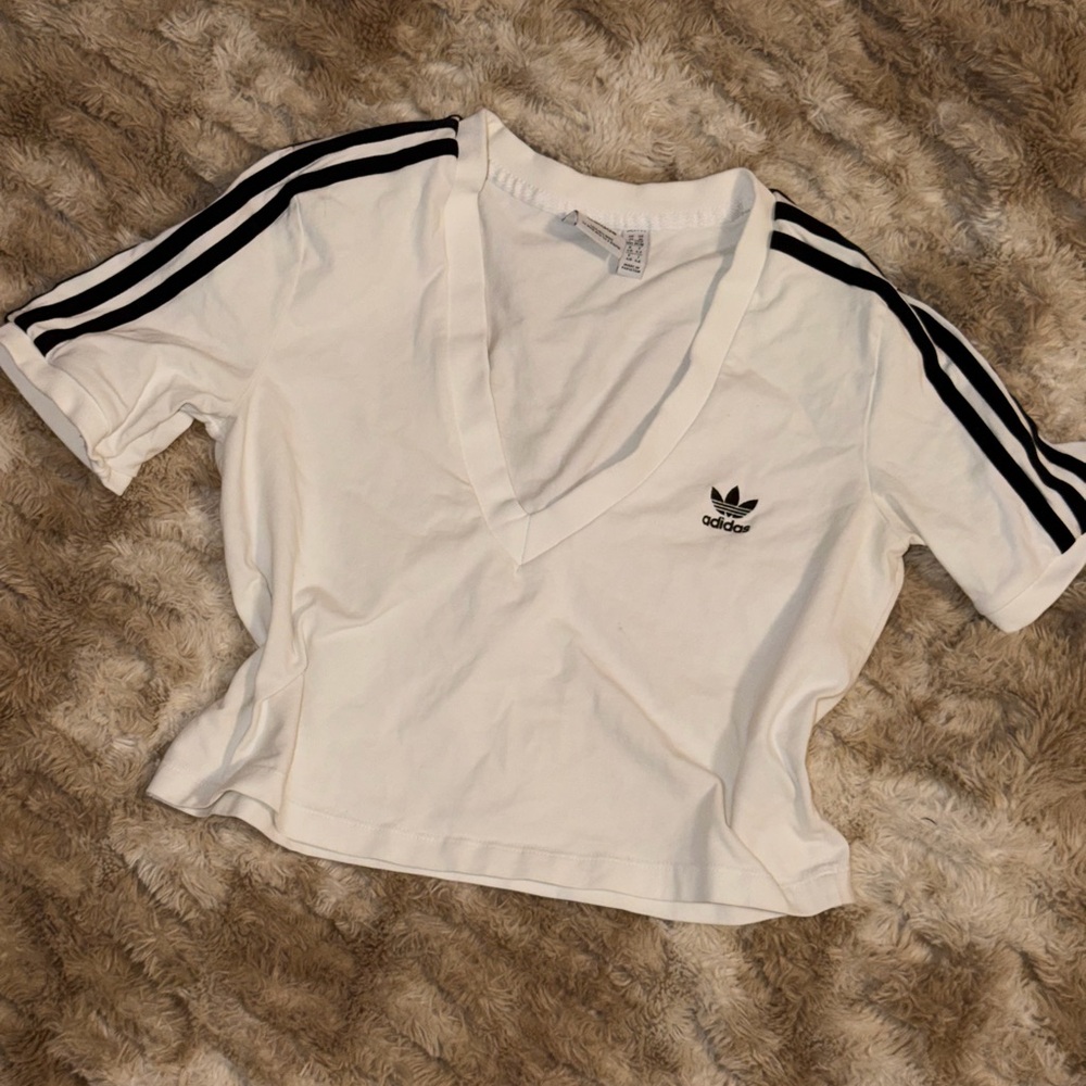 White Adidas Crop Top.
Size Large but Fits Like a Medium.